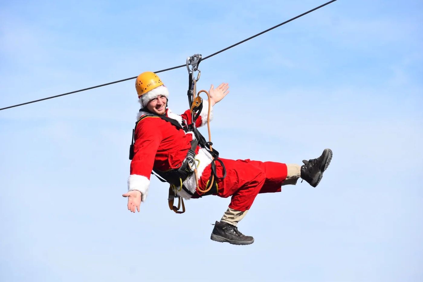 A rider in red zipping on the line